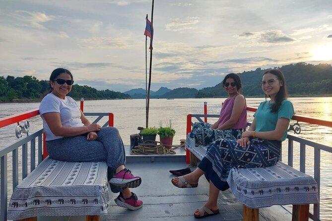 Luang Prabang Mekong Sunset Cruise and Hot Pot Dinner - Boarding the slow boat behind the Royal Palace