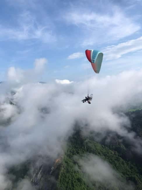 Vang Vieng: Paragliding Experience with Hotel Pickup - Flying above Vang Vieng’s karst country