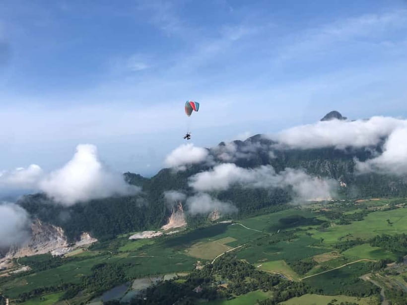 Vang Vieng: Paragliding Experience with Hotel Pickup - Sunrise or afternoon flight, two different moods